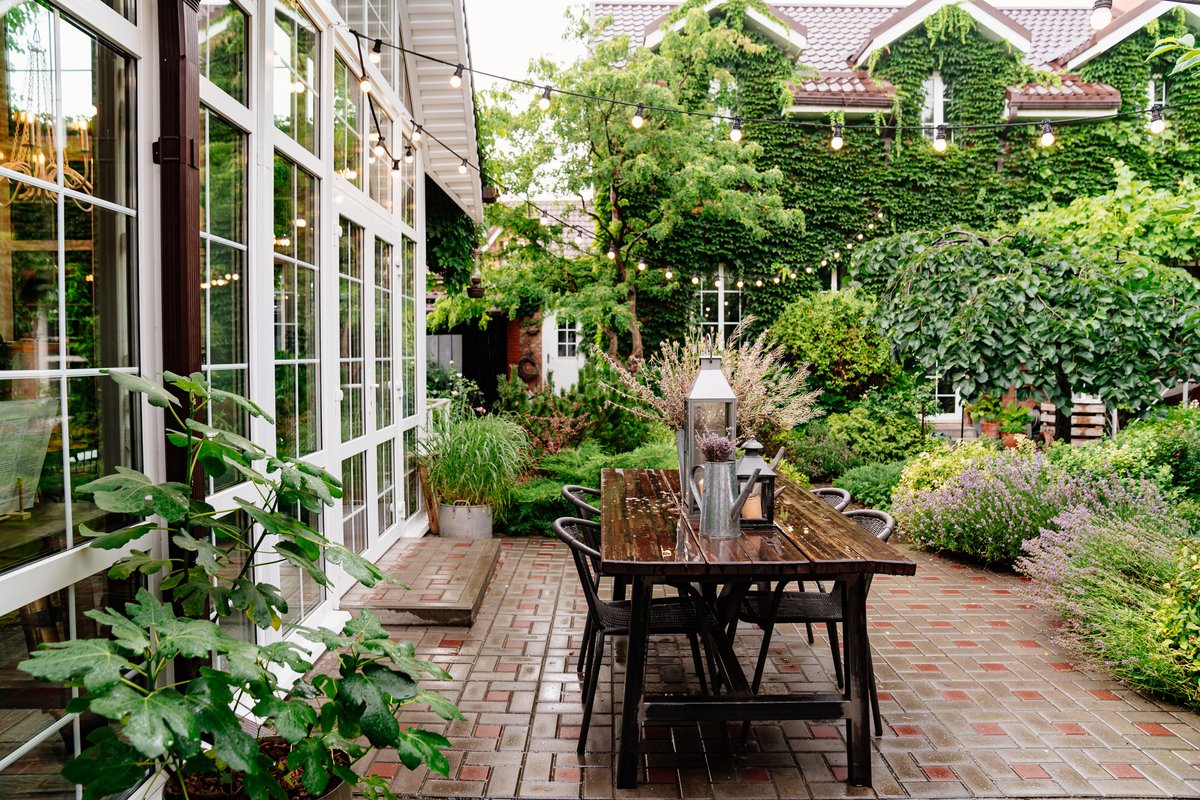 5 backyard trends that are in this year, and 4: that are out, according to landscapers, gardeners, and interior designers