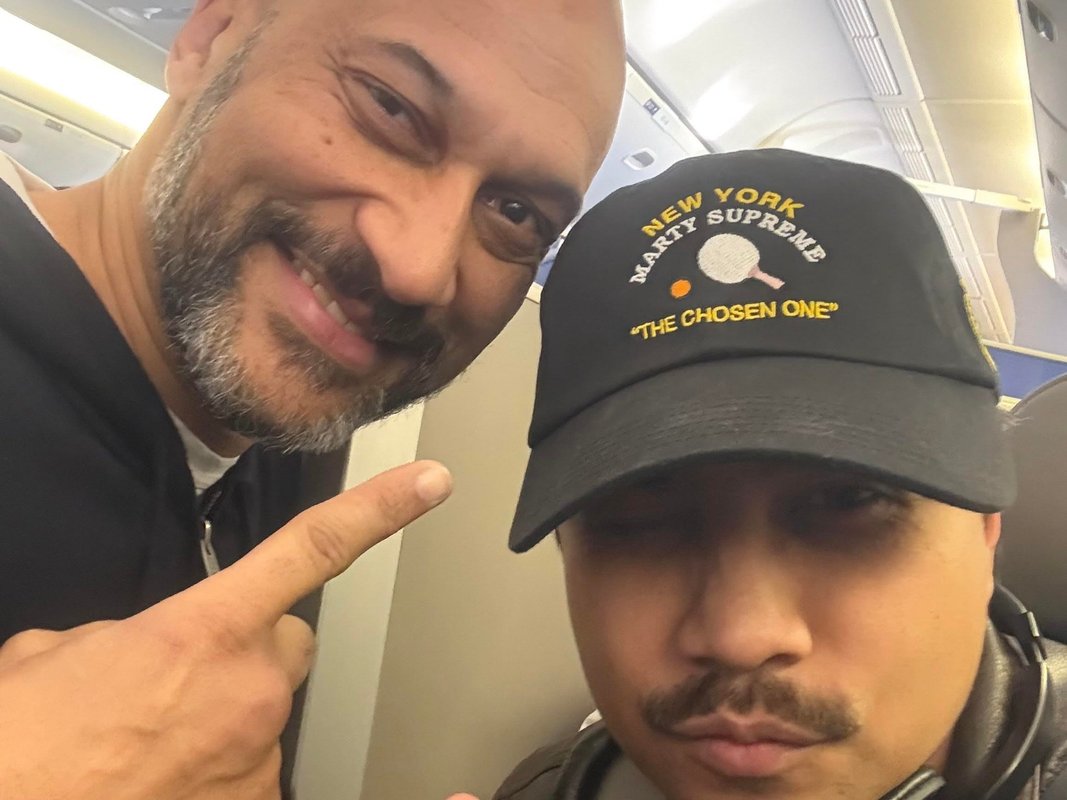 Someone asked to switch our business seats on a plane. I said yes, and got to take photos with one of my favorite celebrities.