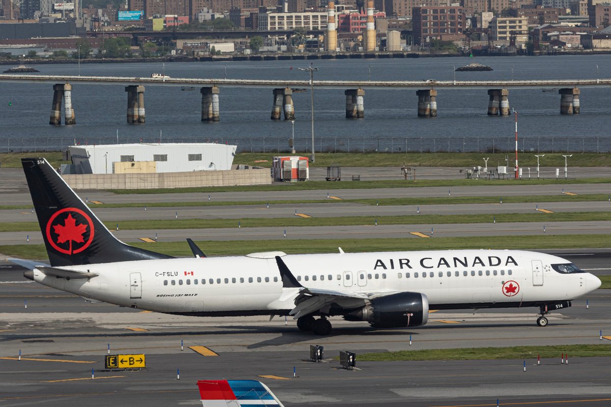 The front of an Air Canada plane was wrecked at LaGuardia after it collided with a vehicle while taxiing