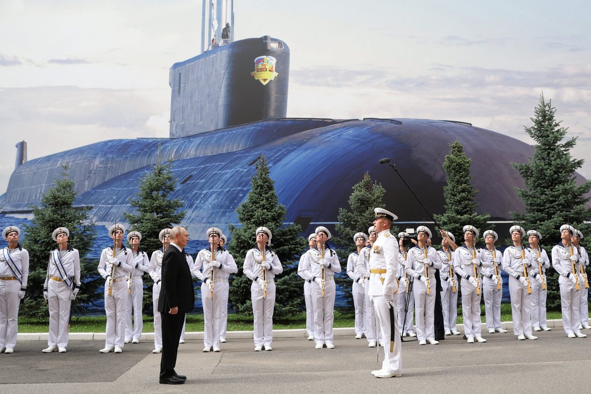 Russia replaced its once-grand Navy Day parade with a shipless event and a giant poster of a submarine