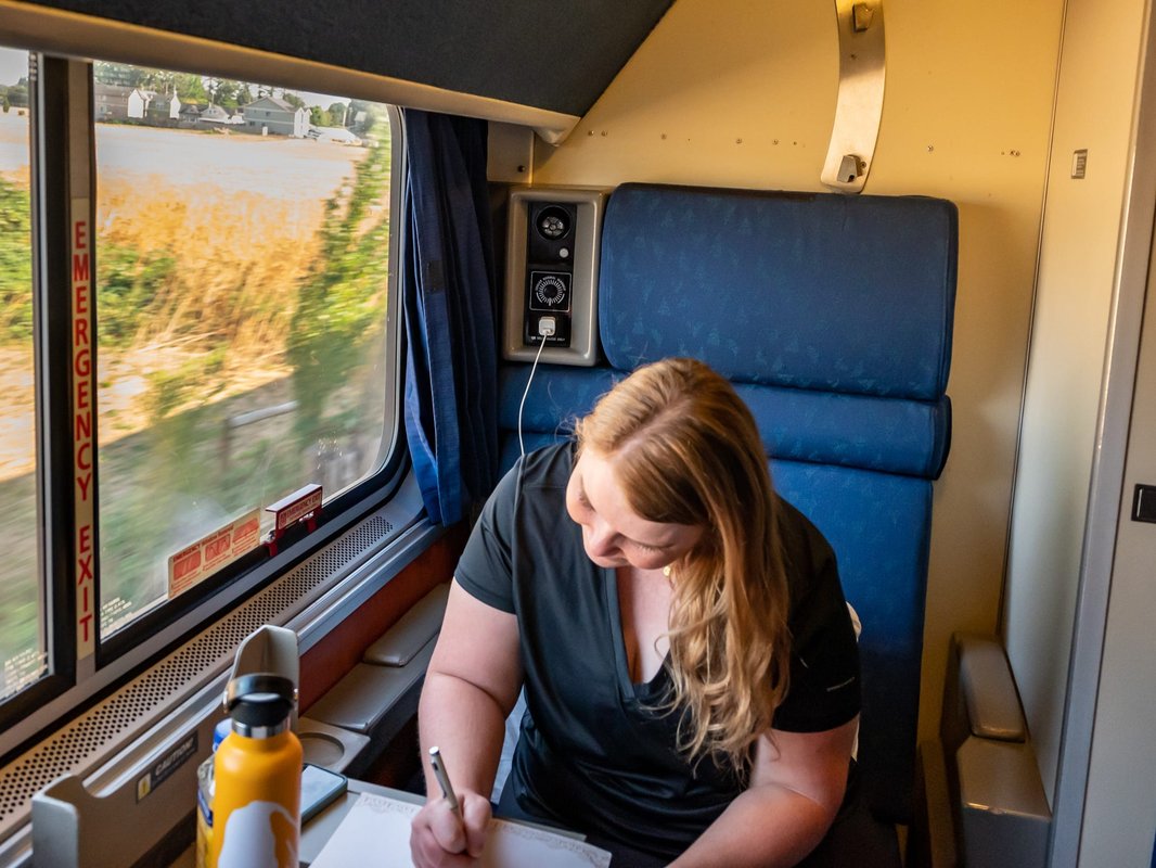 I took a 16-hour Amtrak ride in a roomette. Here are: 4 things I wish I packed and 7 I'm glad I brought.