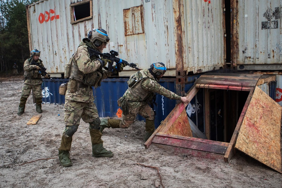 Ukrainian troops are training just beyond the war's reach on NATO soil. Training leaders say that's by design.