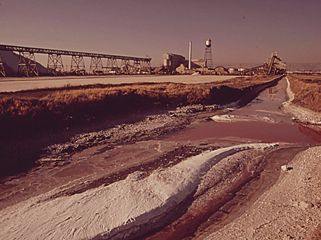 Before EPA regulations, air and water pollution shaped life across the US. See what American cities looked like then.