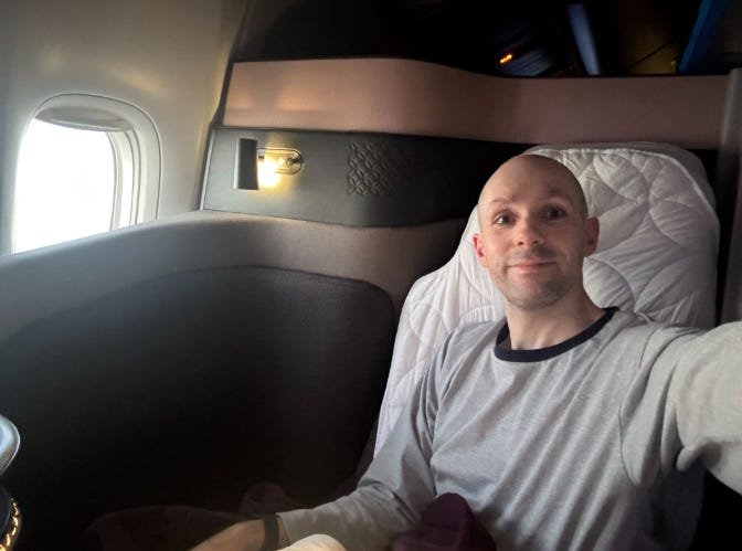 We spent 14 hours in Qatar Airways' Qsuites with our baby. It's easy to see why it's the 'world's best' business class.
