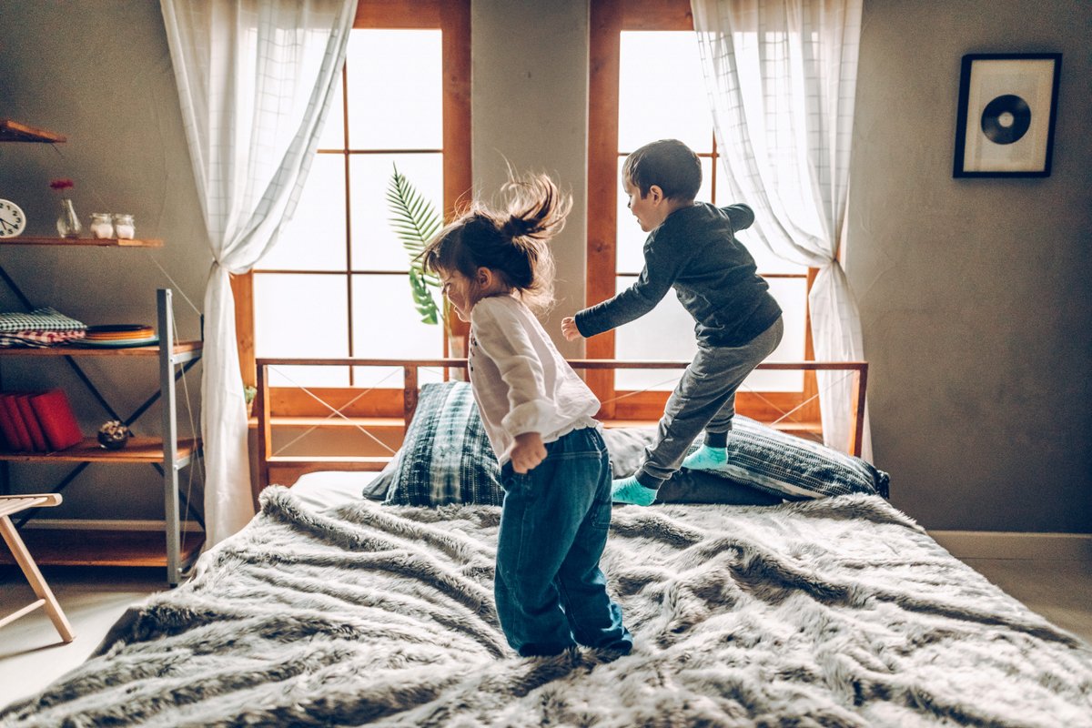 2 kids, 2 adults, 1 queen bed, and no personal space. I regret not splurging on a king-size mattress while my kids were little.