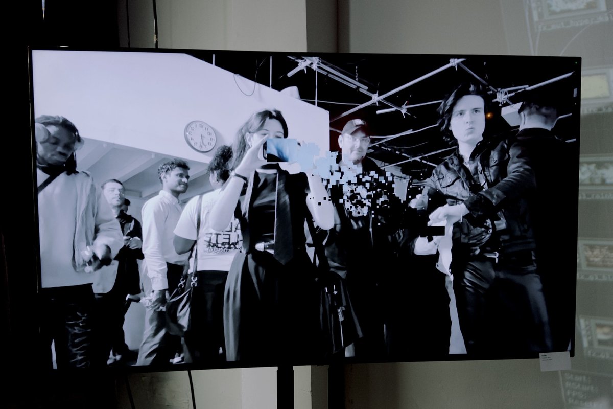 I went to an 'AI psychosis' party in NYC filled with zany art, vibe-coded apps, and Diet Coke