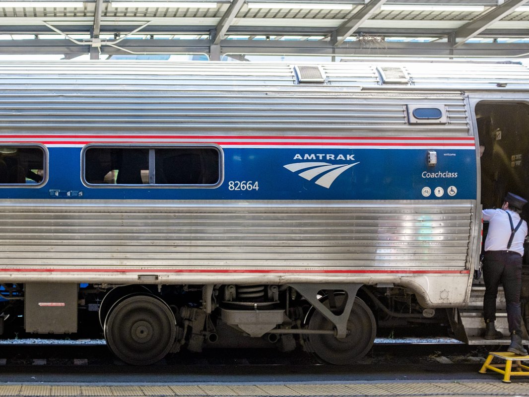I traveled in coach on an Amtrak train from Vancouver to: Seattle for $50. It was cheaper and less stressful than flying.